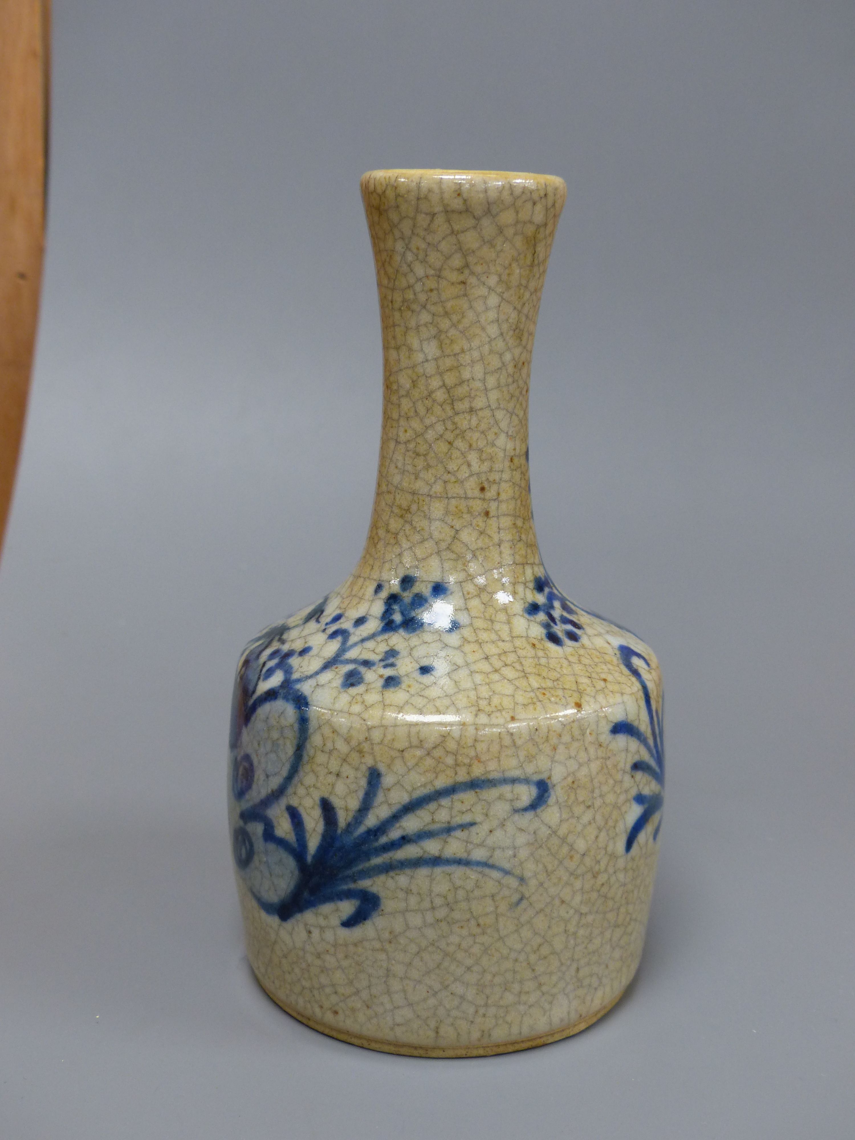 A Chinese blue and white crackle glaze bottle vase, height 15cm